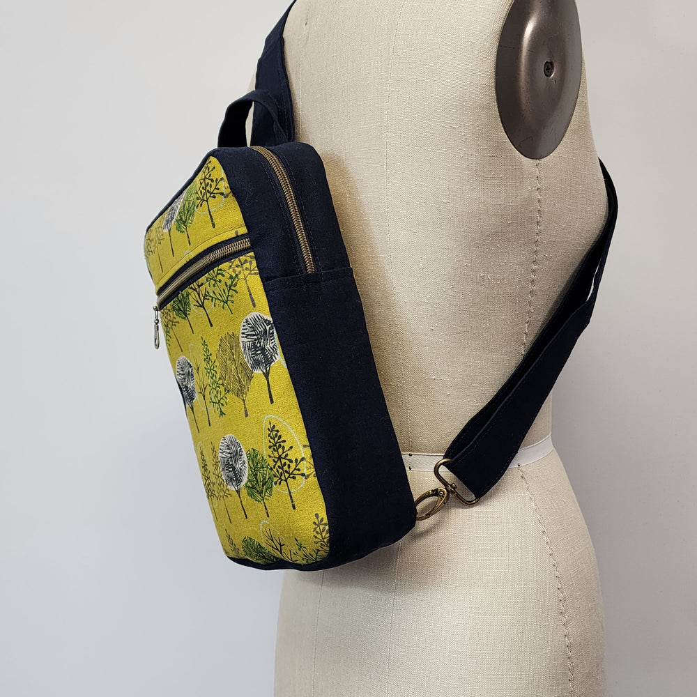 
                  
                    Sling Cross Body Bag in Tree Line
                  
                