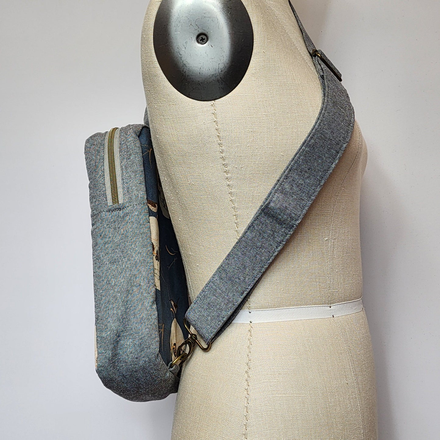
                  
                    Sling Cross Body Bag in Wrented Skulls
                  
                